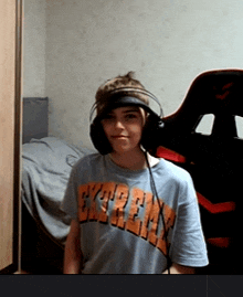 a young boy wearing headphones and a t-shirt that says ' chicago bulls ' on it