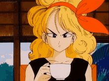 a woman with blonde hair is holding a cup of coffee .