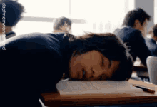 student asian exhausted classroom sleeping