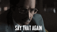 a man with glasses and a mustache has the words say that again above him