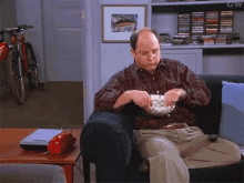 Seinfeld Popcorn GIF - Seinfeld Popcorn Dont Care GIFs