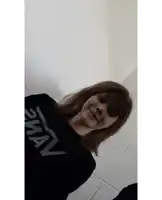 a woman is wearing a black shirt that says swan