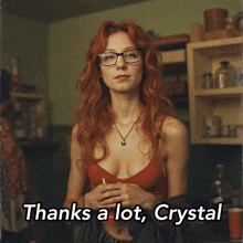 a woman with red hair and glasses says thanks a lot