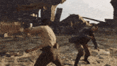 two men are fighting in a video game in front of a ruin