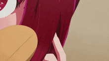 a close up of a person 's hair with a circle in the background