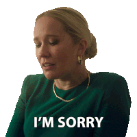 a woman in a green dress says i 'm sorry on a white background