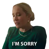 a woman in a green dress says i 'm sorry on a white background