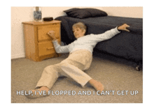 an older woman is laying on the floor with the words help i 've flopped and i can 't get up