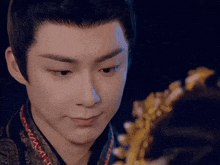 a close up of a man 's face with a saxophone in the background