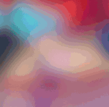 a blurry picture of a person 's face with a red , blue and purple background .