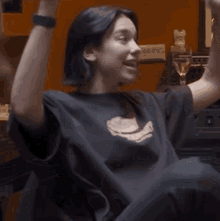 a woman wearing a black t-shirt with a hamburger on it