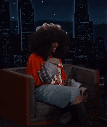 a woman wearing a red jersey that says lions on it