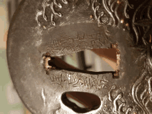 a close up of a piece of metal with a hole in it