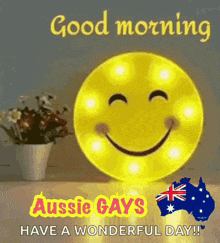 a picture of a smiley face with the words `` good morning aussie gays have a wonderful day '' .