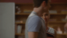 a man and a woman are standing next to each other