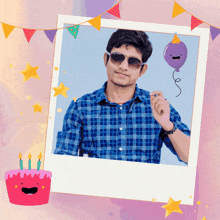 a man in a plaid shirt is holding a balloon in front of a birthday cake with candles