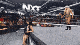 a woman in a wrestling ring with nxt written on it