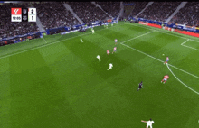 a soccer game is being played and the score is 1 to 2