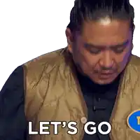 a man wearing a vest says let 's go