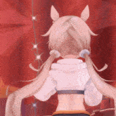 a girl with pigtails and ears is standing in front of a red background