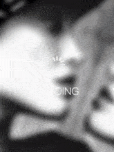 a black and white photo of a person 's face with the word loading on it