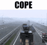 a tractor is driving down a highway with the word cope on the bottom