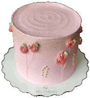 a pink cake with flowers on it sits on a white plate that says rio poloco