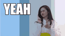 a woman is making a funny face in front of a blue and white background that says yeah