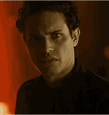 a close up of a man 's face with an angry look on his face