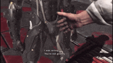a video game screen shows a man shaking hands with a robot and says i was wrong you 're not greedy