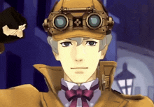 a man wearing a hat with goggles on it