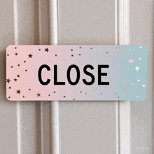 a close sign is hanging on a door