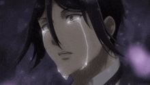 a close up of a person 's face with tears coming out of it