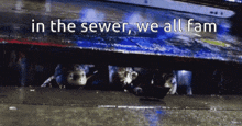 in the sewer we all fam is written on the bottom of a picture