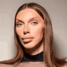 a close up of a woman 's face with a black shirt on