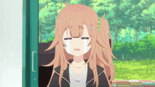 a girl with a ponytail is crying with a tear running down her face