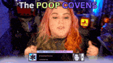 a woman with pink and green hair is giving a thumbs up in front of a screen that says " the poop covens "