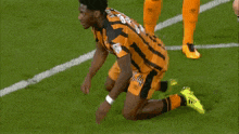 a soccer player wearing a jersey that says ' ford ' on the front