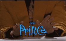 a man 's hands are visible in front of a sign that says prince