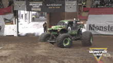 a monster jam truck is driving through the dirt