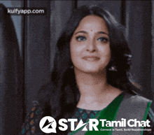 a woman is smiling in front of a star tamil chat banner
