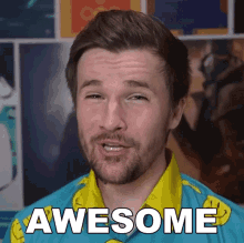 a man with a beard wearing a blue shirt that says awesome on it
