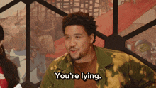 a man says " you 're lying " while standing in front of a painting
