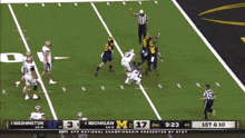 a football game between washington and michigan is being played