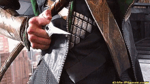 a close up of a person 's hand holding a knife .
