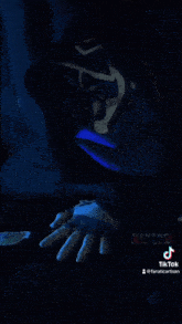 a tiktok video of a person in a blue hoodie