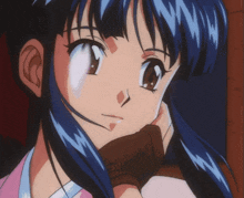 a close up of a cartoon character with blue hair