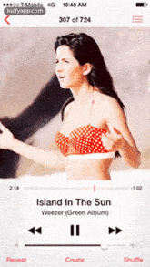 a woman in a bikini is playing island in the sun weezer green album