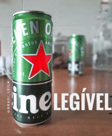 a green and black can of heineken with a red star on it