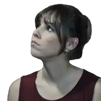 a close up of a woman 's face looking up